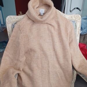 Soft beige Turtle neck labeled "XS" but fits up to Medium